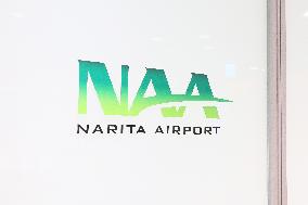 Narita International Airport (NAA) signage and logo